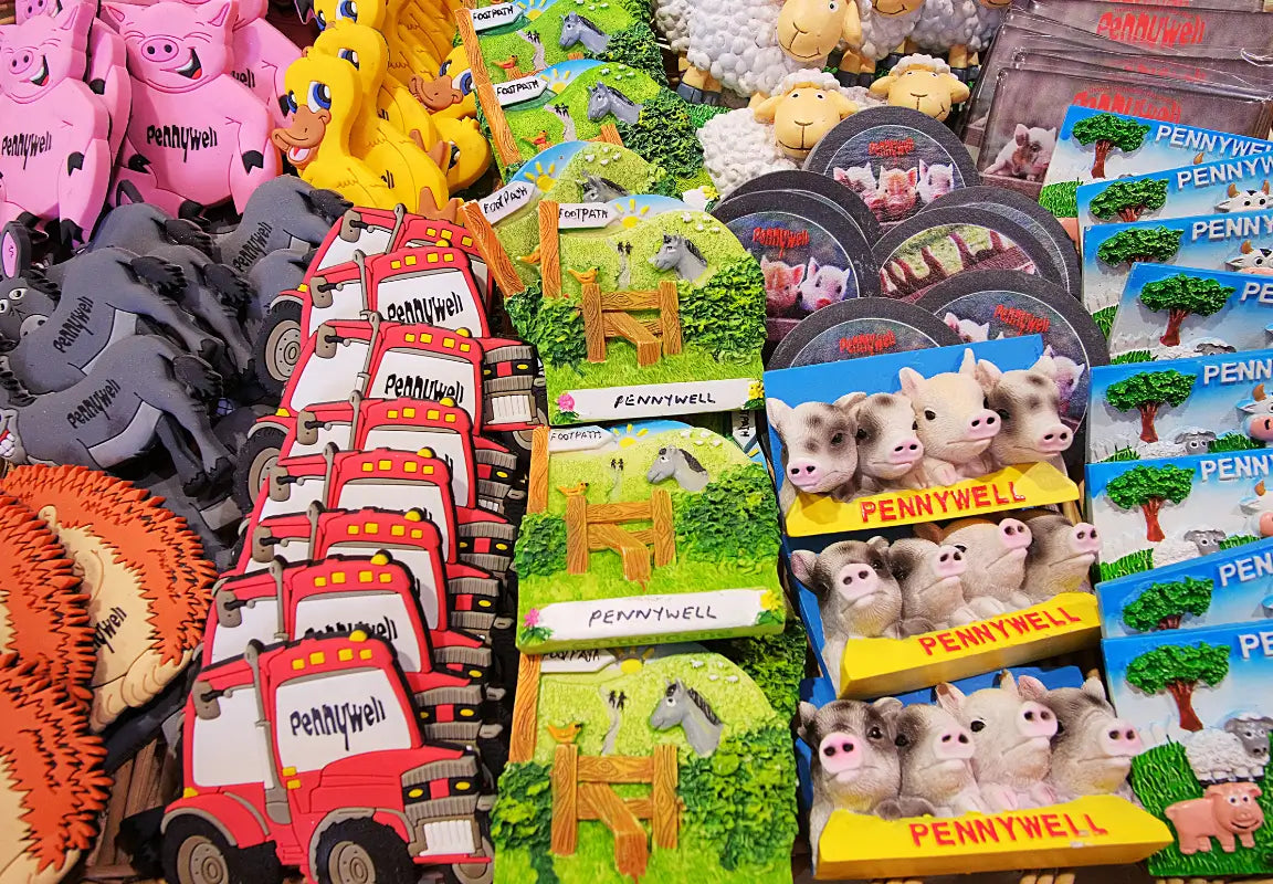 various animal-themed souvenirs, including pigs, ducks, sheep, and trucks, all labelled with